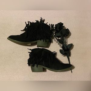 A pair of fringe booties.